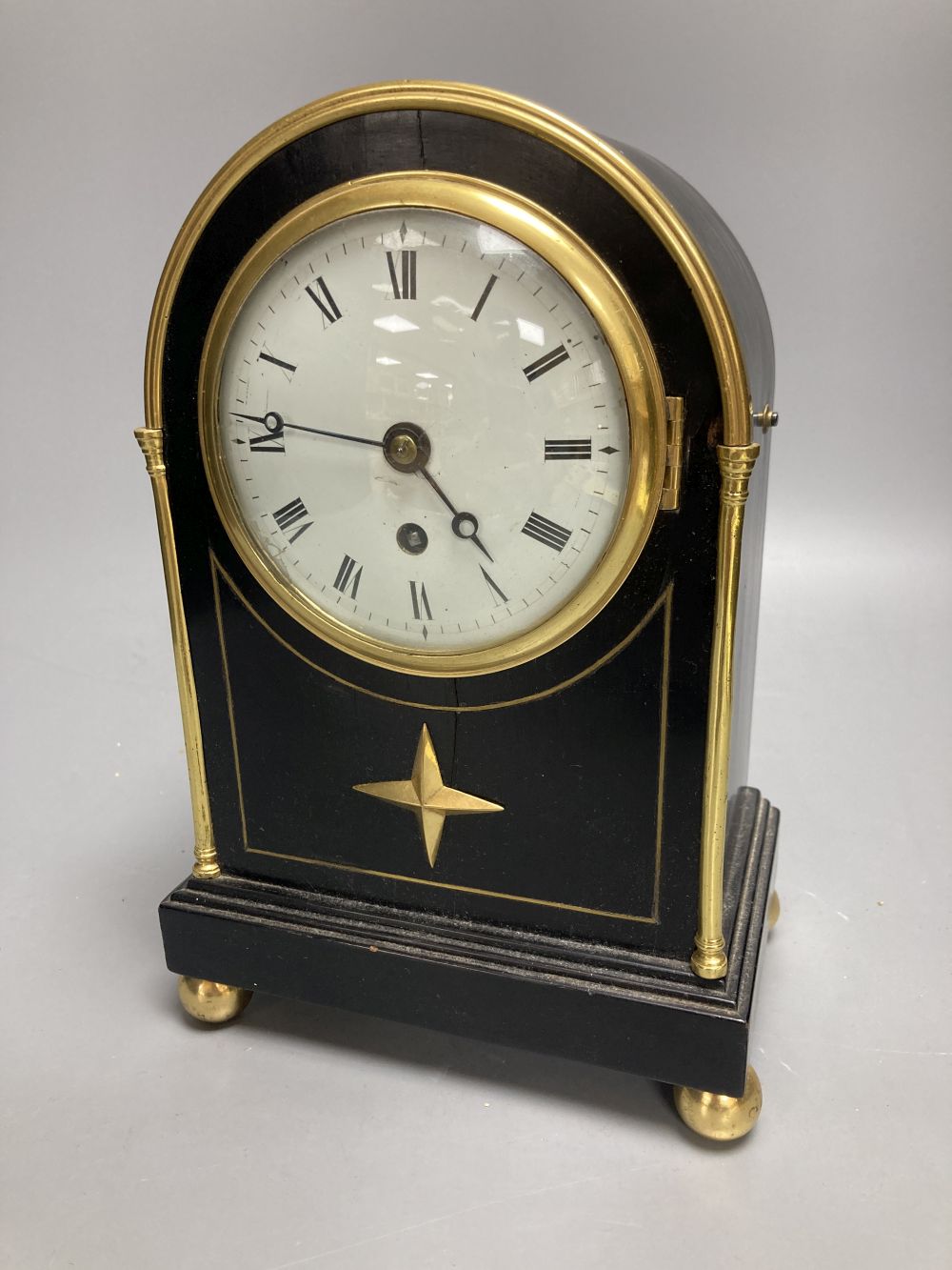 An early 19th century Desbois and Wheeler mahogany mantel timepiece, ebonised case with brass mounts, 9.5cm convex enamel dial, back-pl